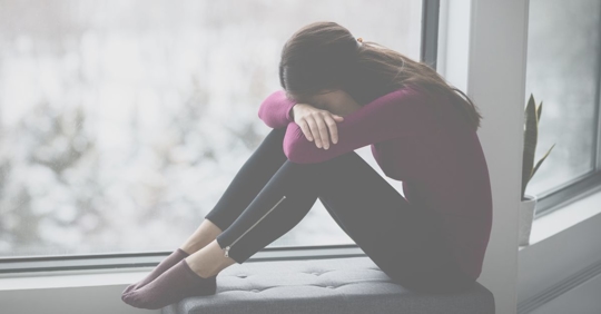 a solemn looking woman