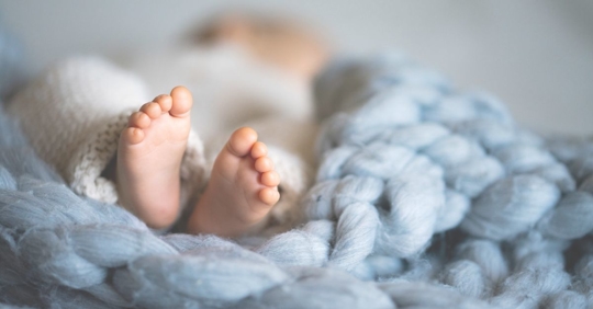 a newborn baby's feet