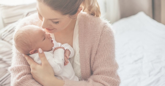 a mother holding a newborn