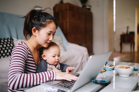 Mother and baby using laptop