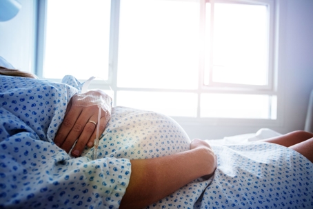 a pregnant woman in a hospital bed